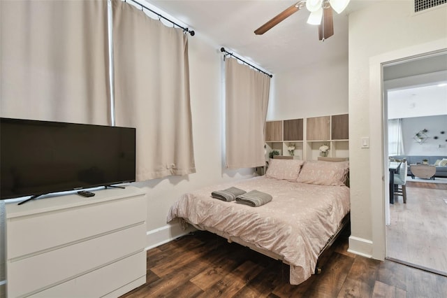 bedroom featuring ceiling fan and dark hardwood / wood-style flooring