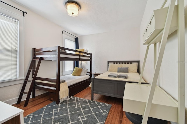 bedroom featuring dark wood-type flooring