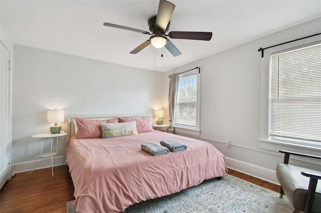 bedroom featuring dark hardwood / wood-style floors and ceiling fan