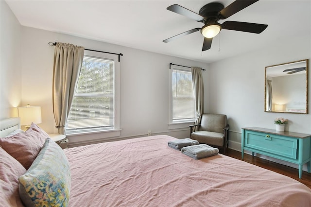 bedroom featuring ceiling fan and dark hardwood / wood-style flooring