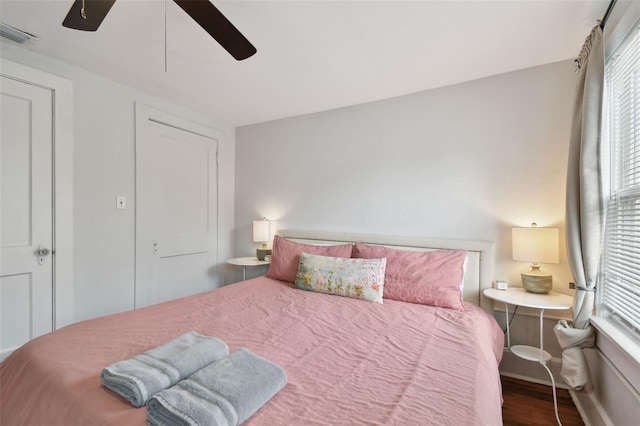 bedroom with hardwood / wood-style floors and ceiling fan