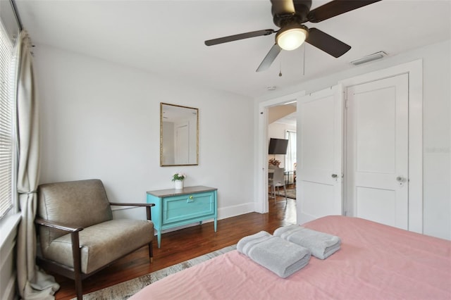 bedroom featuring dark hardwood / wood-style floors and ceiling fan