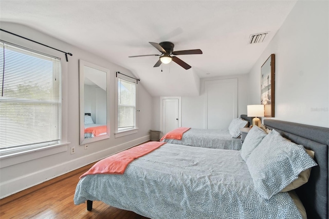 bedroom featuring lofted ceiling, hardwood / wood-style floors, and ceiling fan