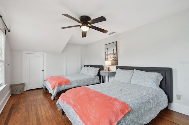 bedroom with ceiling fan and dark hardwood / wood-style floors