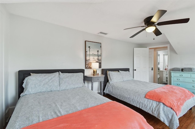 bedroom with dark hardwood / wood-style floors and ceiling fan