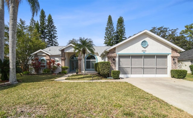 ranch-style home featuring a garage and a front lawn