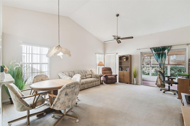 dining space featuring ceiling fan, high vaulted ceiling, a healthy amount of sunlight, and carpet