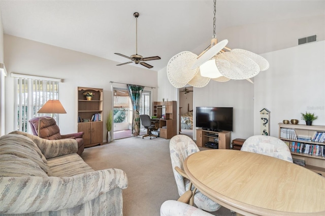 living room featuring ceiling fan, plenty of natural light, light colored carpet, and high vaulted ceiling