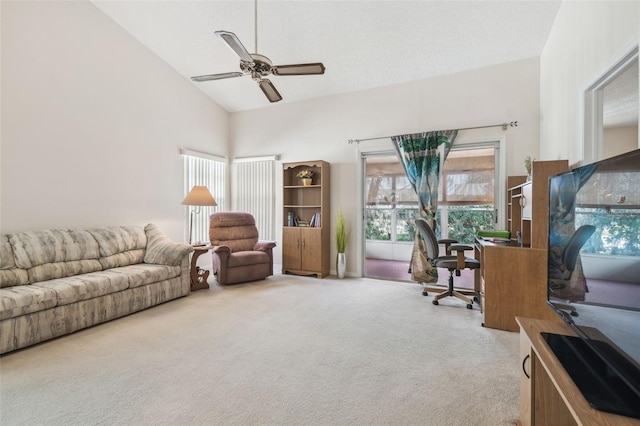 carpeted office space featuring high vaulted ceiling and ceiling fan