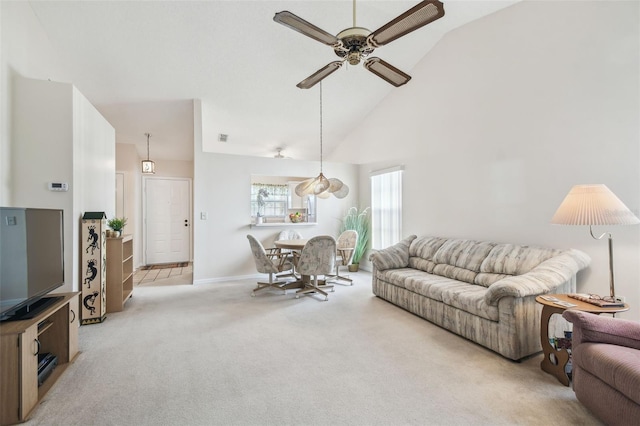 living room with light carpet, high vaulted ceiling, and ceiling fan