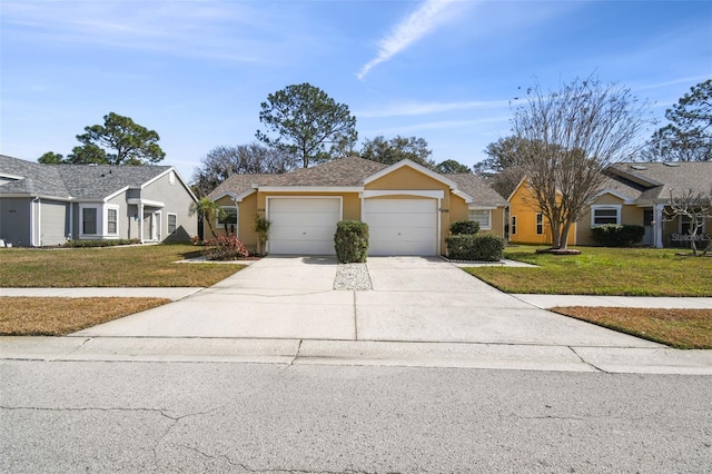 ranch-style house with a garage and a front lawn