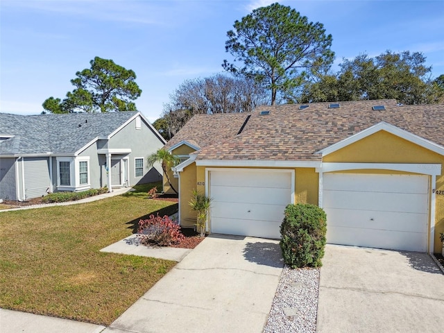 ranch-style house featuring stucco siding, concrete driveway, a front yard, a shingled roof, and a garage