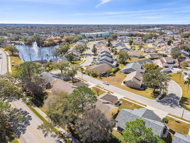 bird's eye view featuring a water view and a residential view