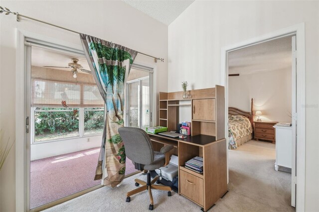 office with carpet floors and a ceiling fan