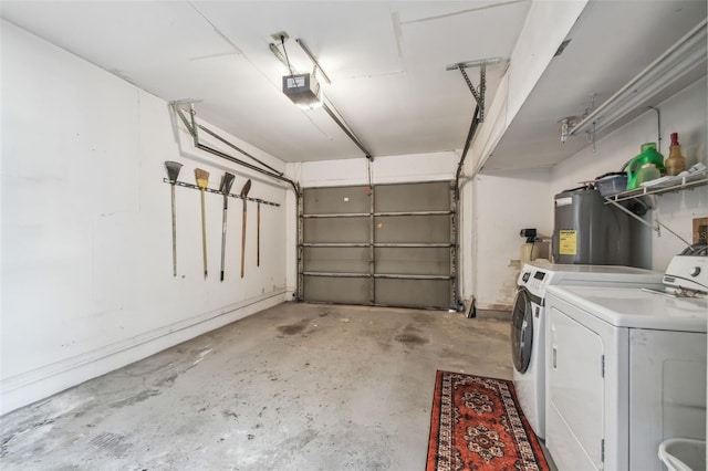 garage with washer and dryer, electric water heater, and a garage door opener