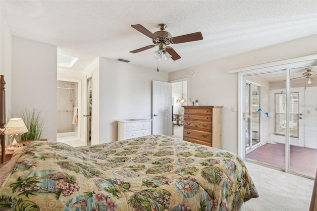 carpeted bedroom with access to outside, a ceiling fan, visible vents, and a textured ceiling