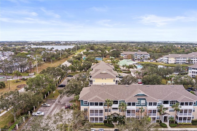 birds eye view of property with a residential view and a water view