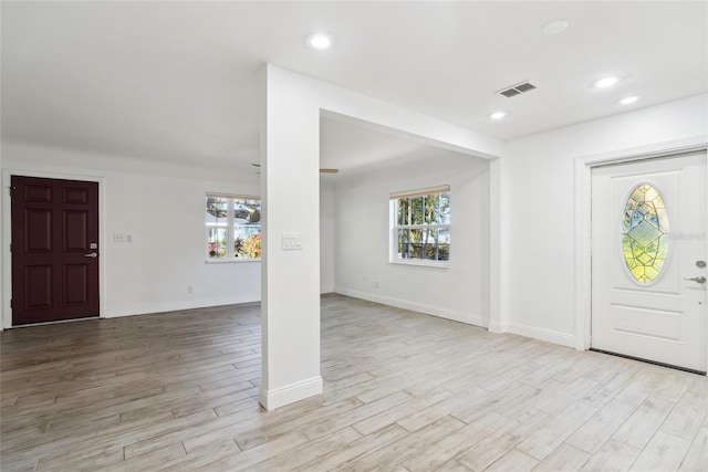 entrance foyer featuring a healthy amount of sunlight and light hardwood / wood-style floors