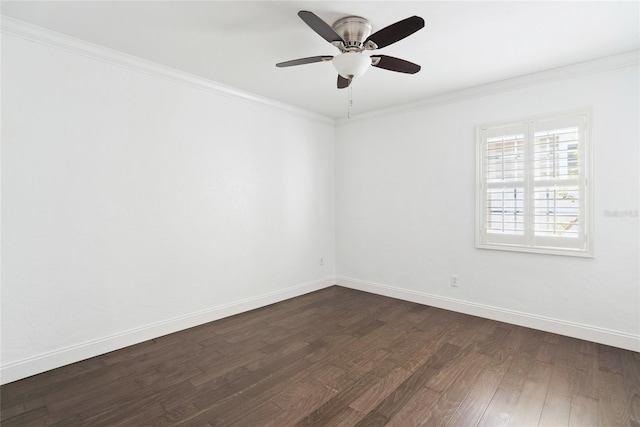 spare room with dark hardwood / wood-style flooring, crown molding, and ceiling fan