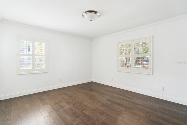 empty room with crown molding, dark wood-type flooring, and a wealth of natural light