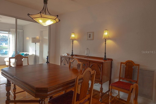 dining area featuring light wood-type flooring