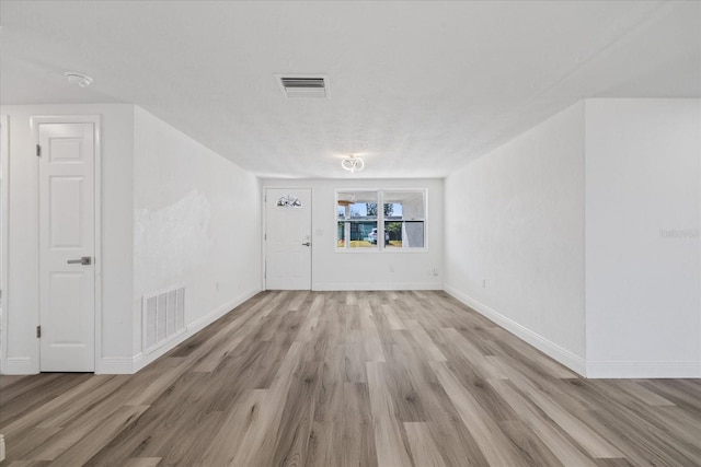 unfurnished living room with light wood-type flooring