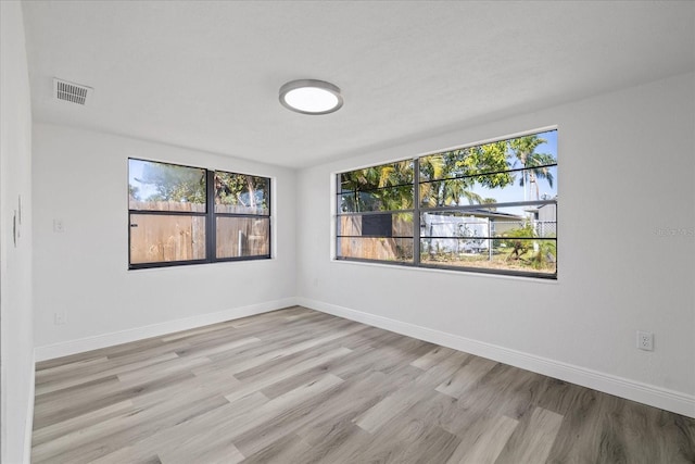 spare room with light wood-type flooring