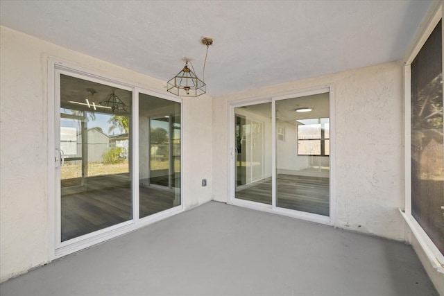 unfurnished sunroom featuring plenty of natural light