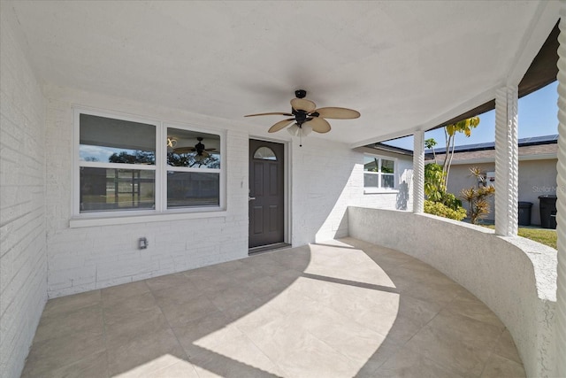 view of patio / terrace featuring ceiling fan