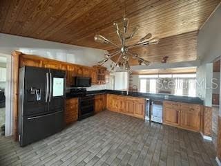 kitchen with wood ceiling, kitchen peninsula, dark wood-type flooring, and black appliances