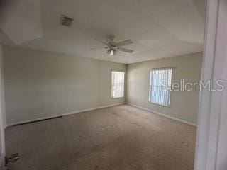 spare room with ceiling fan and carpet flooring