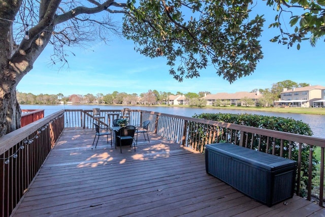 wooden terrace with a water view