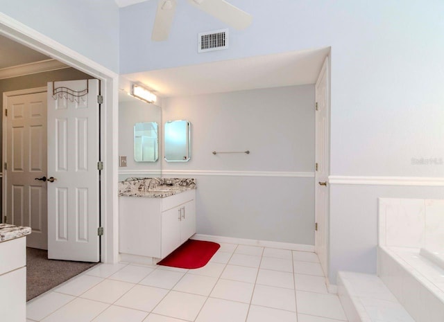 bathroom with vanity, tile patterned floors, ceiling fan, and a tub to relax in