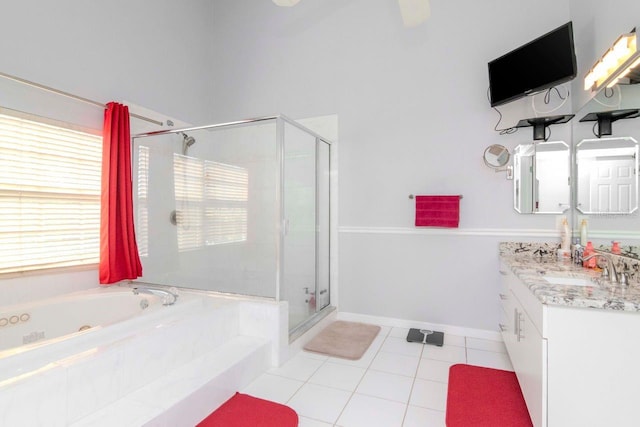 bathroom featuring plus walk in shower, tile patterned floors, and vanity