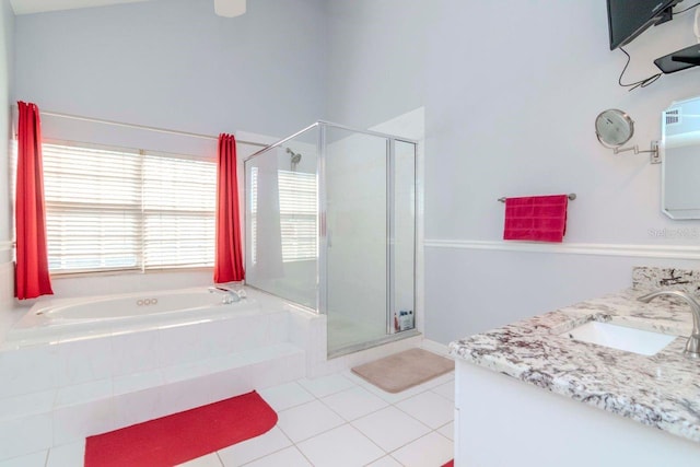 bathroom with vanity, shower with separate bathtub, and tile patterned floors