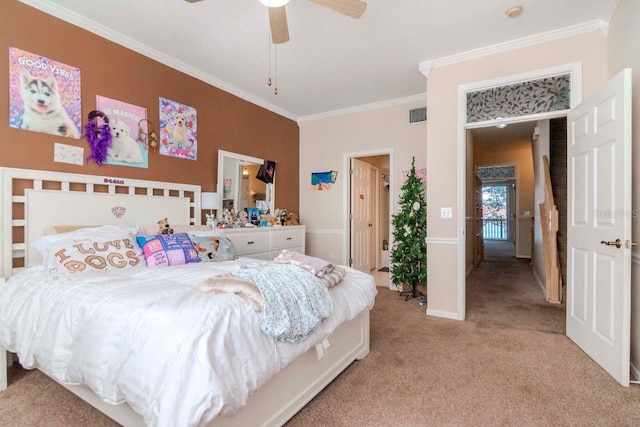 carpeted bedroom with ceiling fan and ornamental molding