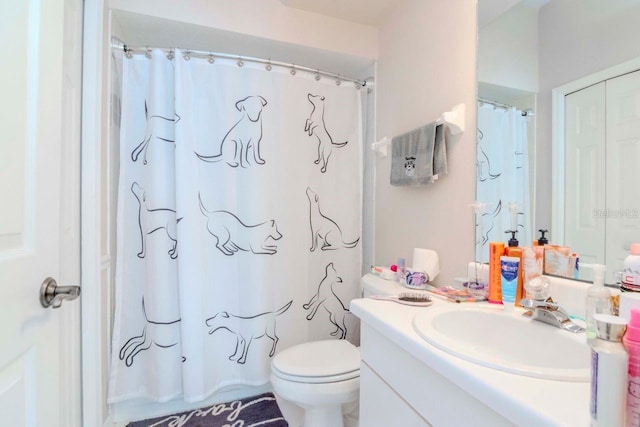 bathroom featuring walk in shower, vanity, and toilet