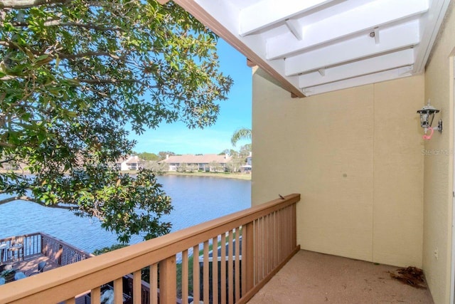 balcony featuring a water view