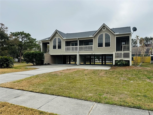 view of front facade with a carport and a front yard