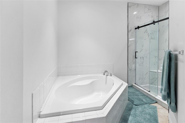 bathroom with shower with separate bathtub