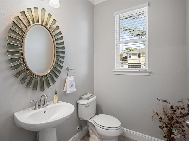 bathroom featuring sink and toilet