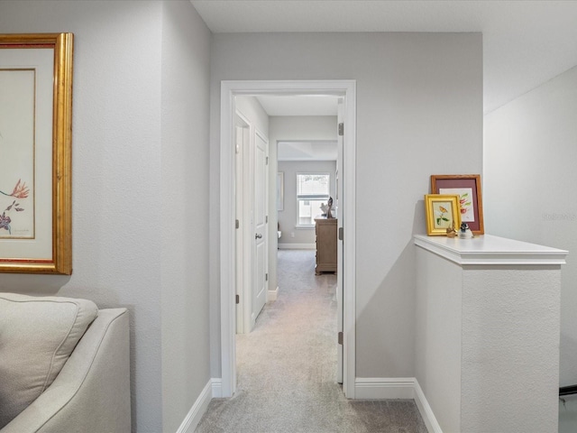 hallway with light carpet