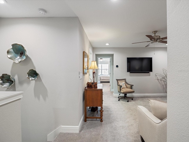 living room with carpet floors and ceiling fan