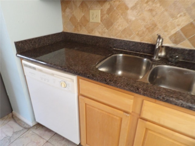 kitchen with light brown cabinetry, sink, dishwasher, dark stone counters, and decorative backsplash