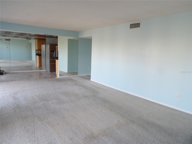 empty room with light colored carpet