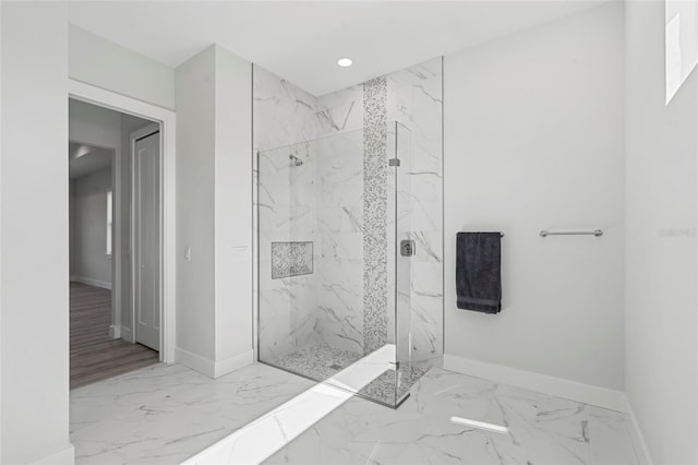 bathroom with tiled shower