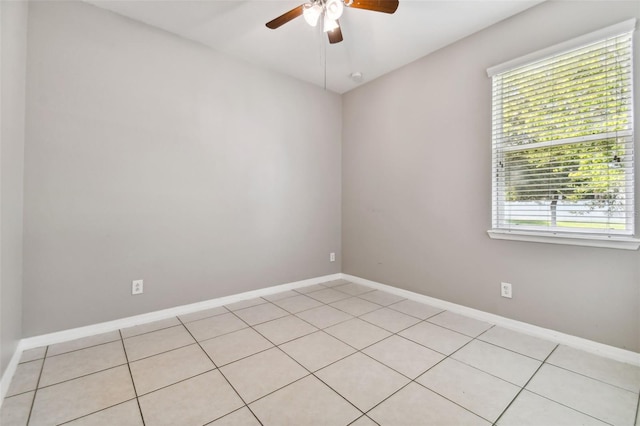 tiled empty room with ceiling fan