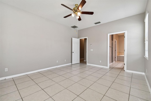 unfurnished bedroom with light tile patterned floors and ceiling fan