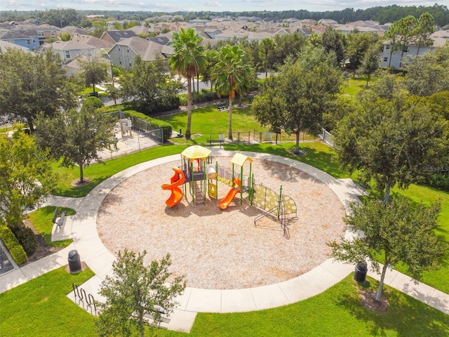 view of property's community with a lawn and a playground