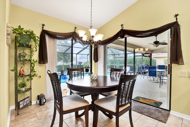 dining area with lofted ceiling and ceiling fan with notable chandelier